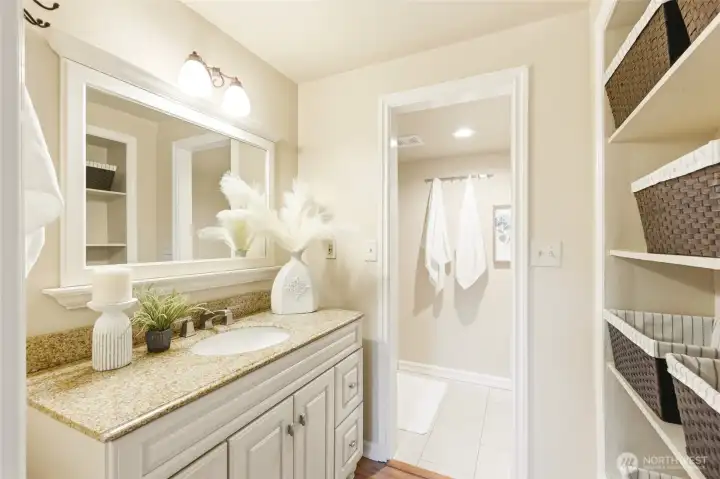 Primary bathroom has plenty of storage.
