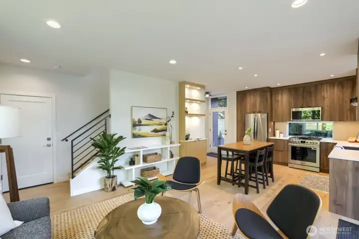 The living room has an entertainment wall, pre-wired for TV and a fireplace.