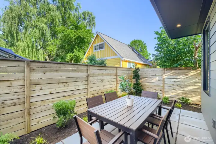 A lovely landscaped patio and fenced yard.