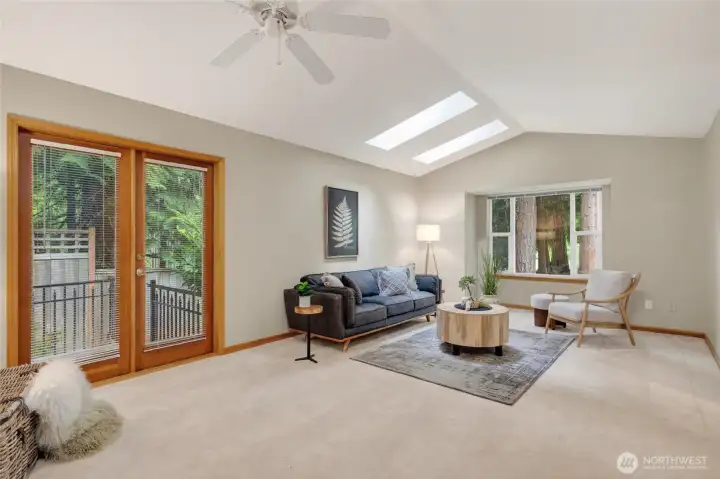 The living room has fir French doors that lead to the side yard that is fenced.