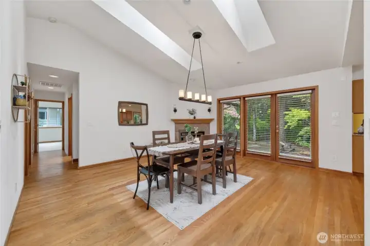 The open formal dining room has a gas fireplace and opens onto the rear deck that is plumbed with natural gas and has a covered BBQ area.