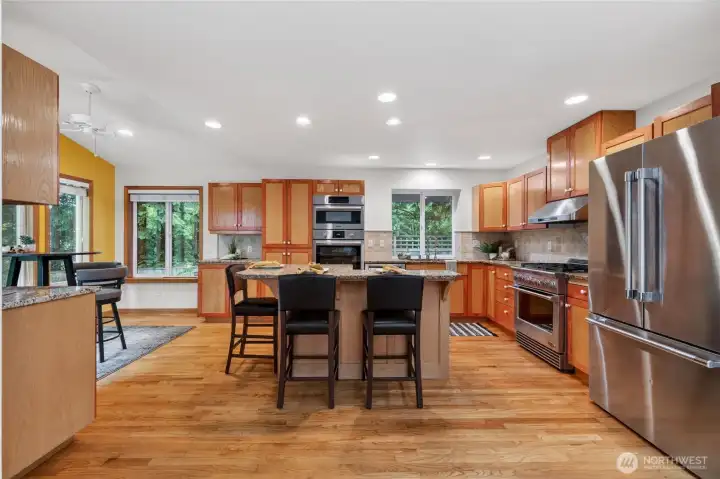 The kitchen truly is very spacious and has an informal eating area as well as an eating bar at the island.