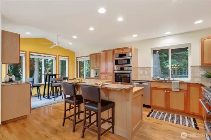 The view from the kitchen sink is tranquil and filled with nature.