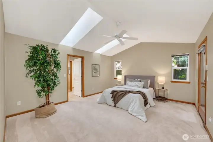 The primary suite is very spacious and also has skylights.