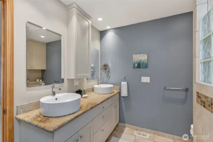 There is a 3/4 bath off the primary bedroom and there is a large 2-sink vanity.