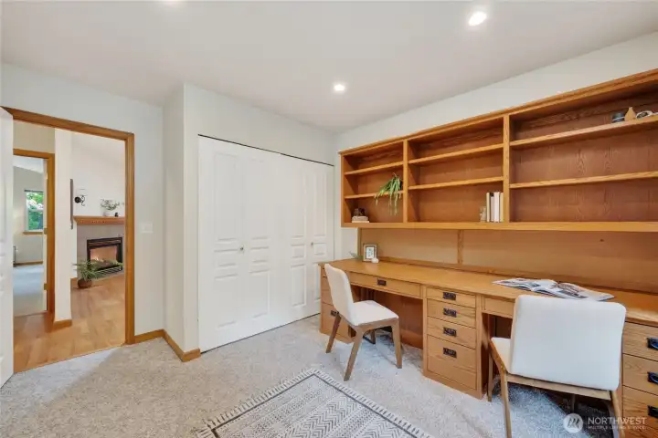 Looking across the hall from the 2nd bedroom which is currently used as an office.