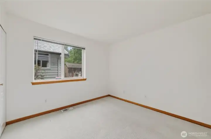 The 3rd bedroom looks out to the rear and south side yard.