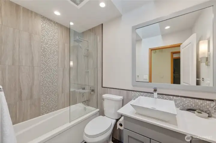 The full bath down the hall for guests and the users of the other bedrooms.
