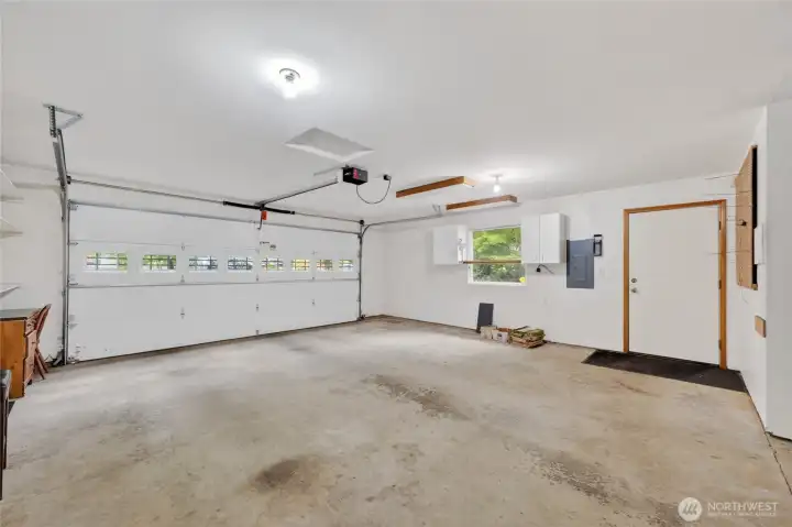 Looking across the garage to the side door that opens to the south side yard and the detached work shop.