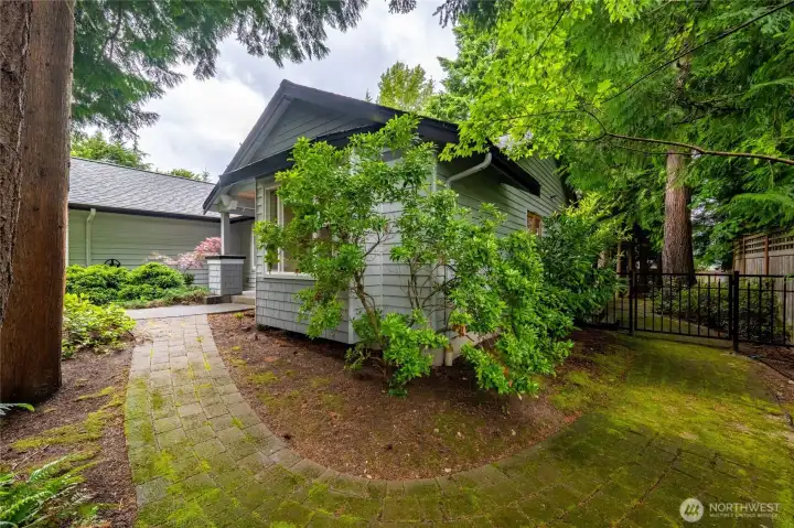 There is a nice paver sidewalk from the front of the home around to the north side yard.