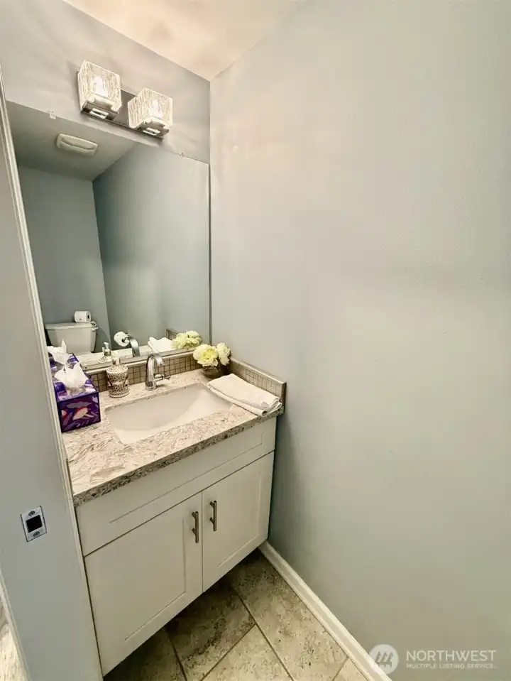 Unit B half bath in hallway. Unit A has the same.