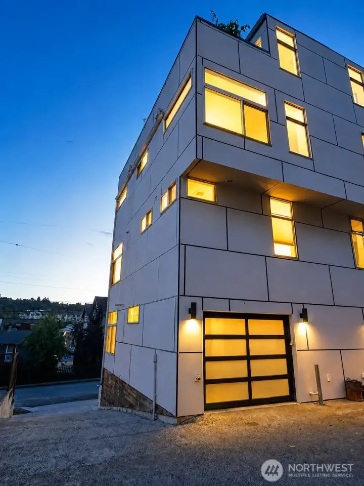 Attached Car Garage Offering Additional Storage Space