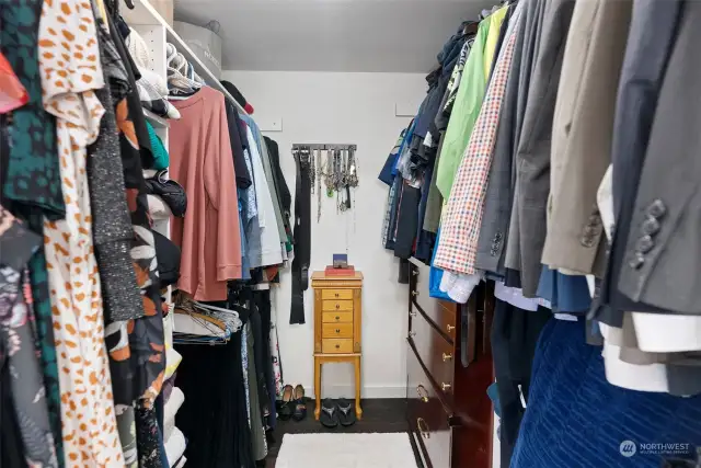 No fighting, there is plenty of space in this large walk-in closet.