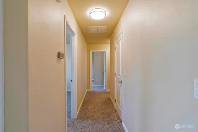 Hallway to Bedrooms - Pantry closet door on right