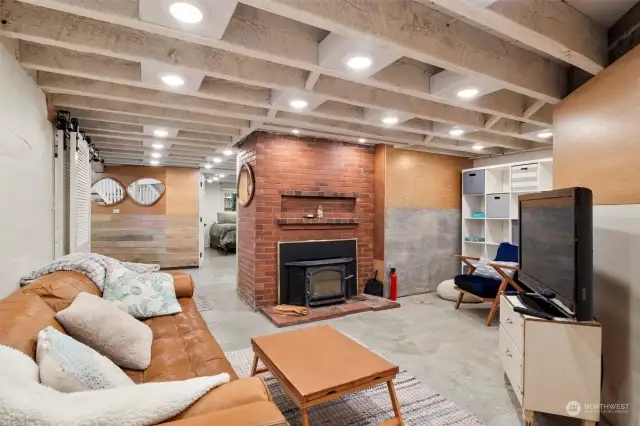 Downstairs family room with cozy fireplace.