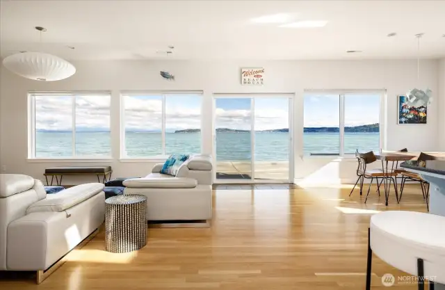 A warm and rich interior give way to the stunning seascape and mountains beyond. This great rooms lives large & takes advantage of all that view!
