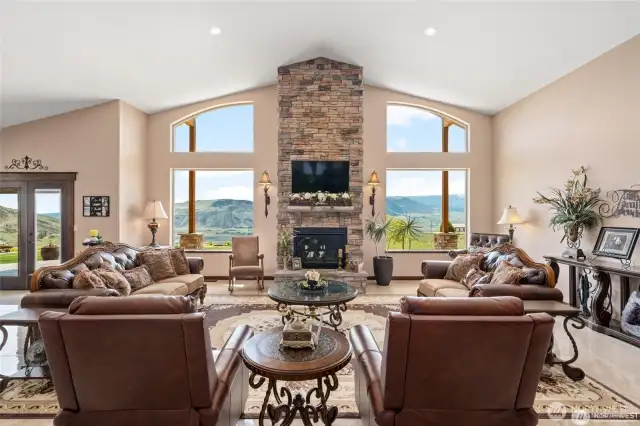 Living room with floor to ceiling fireplace and big views!