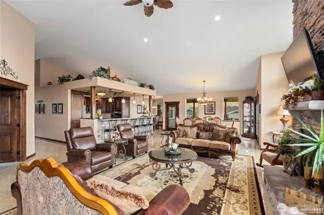 Kitchen with eating bar, living room and looking into the dining room.
