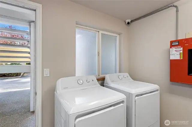 Shared washer and dryer located next to unit