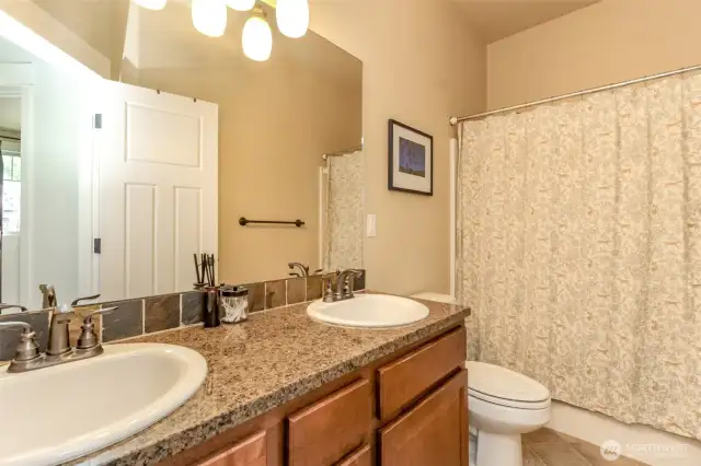 Full bath with added bonus of double sinks
