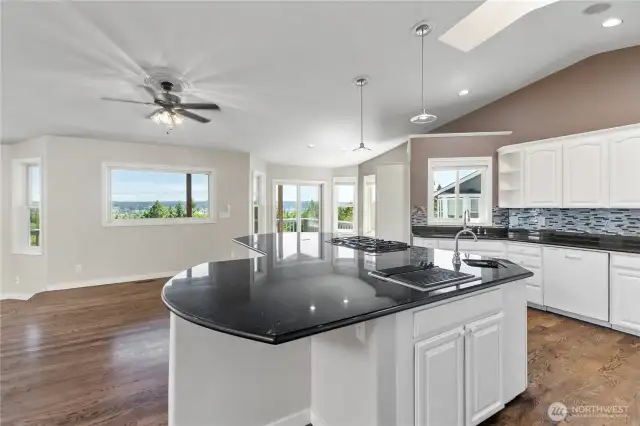 ENORMOUS chef's kitchen boasting two ovens, grill top, gas range, two sinks, and more!
