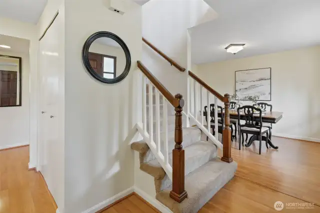 Hallway leads to open family room and kitchen with eating area.