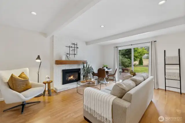 Family room off the kitchen with gas fireplace and slider to the backyard and access to Conifer View Park.