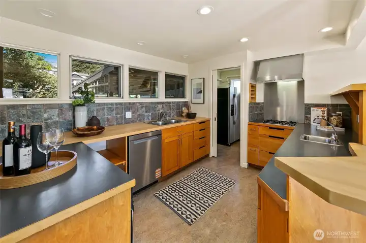 Thoughtfully designed kitchen with amazing storage, gas cooktop, separate oven, and a pantry.