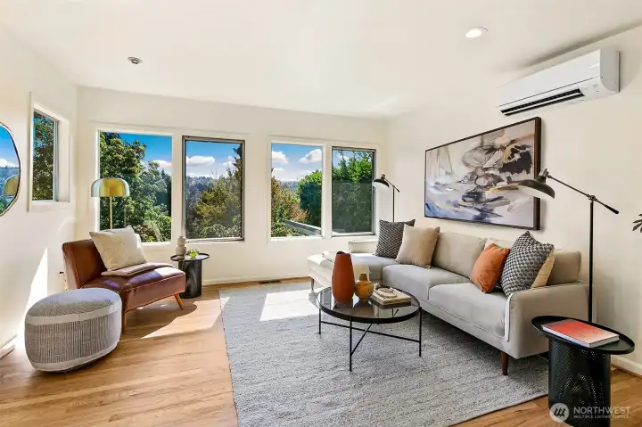 Main level living area also faces south, overlooking the backyard garden.