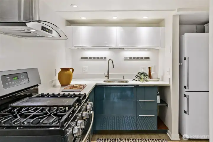 The second kitchen has a gas stove, and gleaming, efficient modern cabinetry. Lovely for guests or as a nice family room perk.