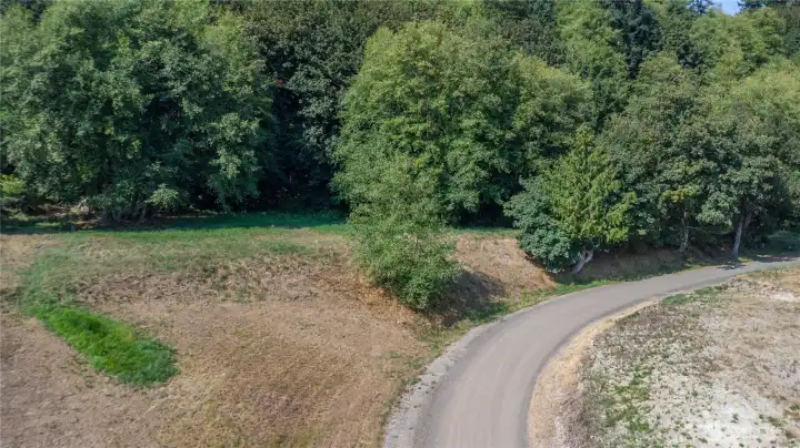 The proposed driveway to Lot 2 is to the left of where the gravel road ends in the right-hand side of this photo.