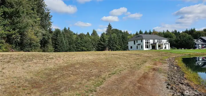 Lot is to the left of the house.