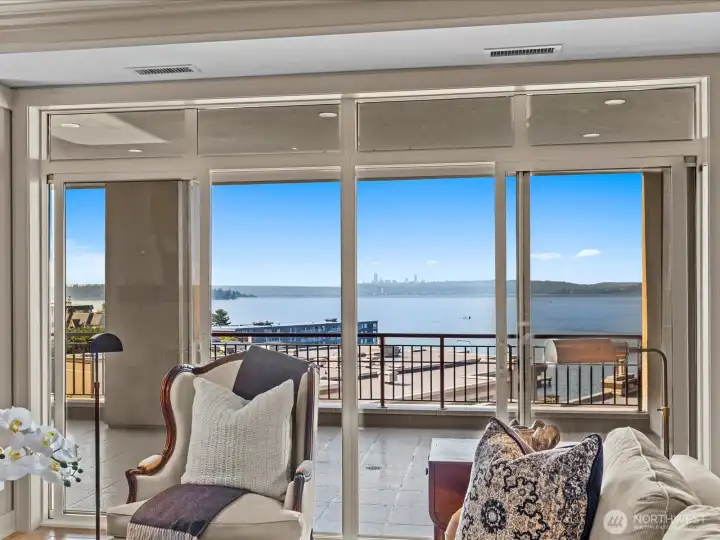 Deck area and view from the living room. External electric window shades on living room and family room windows that are adjacent to the deck.