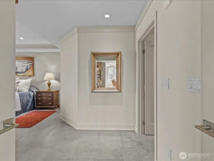 French doors opening into the spacious Primary bedroom and bathroom.