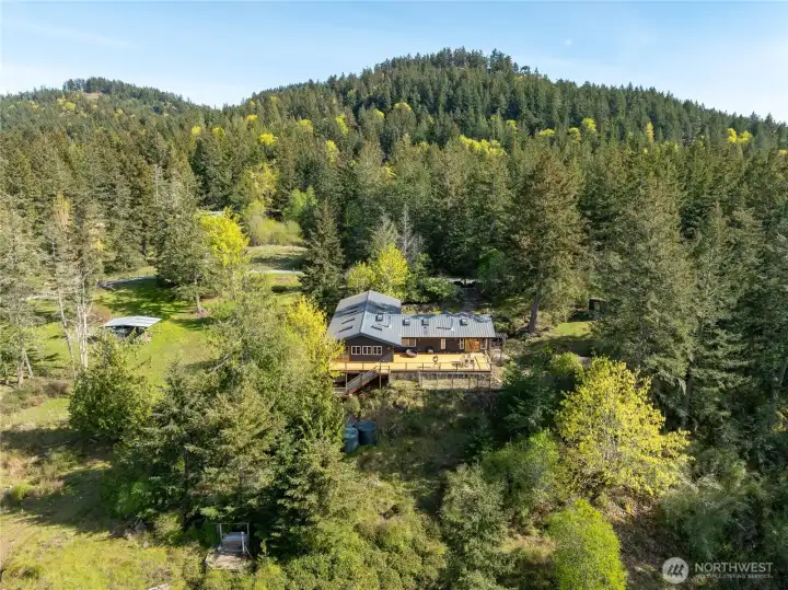 Sited on 6.5 acres of forest and pasture between the ferry landing and the main village of Eastsound.