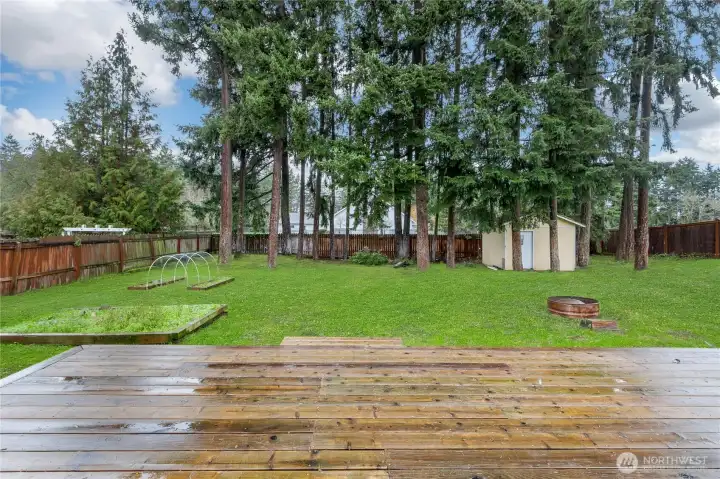 French door from dining area opens to oversized newer deck, creating a seamless indoor-outdoor flow perfect for entertaining or relaxing
