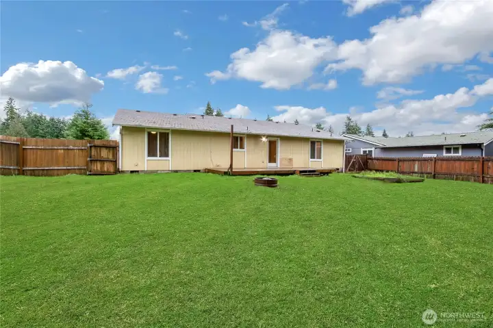 generous, hard to find .29 acre fully fenced lot offers an ideal private space for hosting gatherings, gardening, or simply relaxing on your spacious outdoor deck