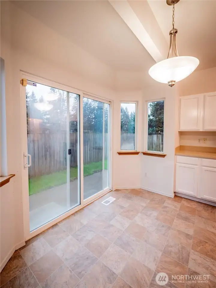 BREAKFAST NOOK AND SLIDER TO BACKYARD