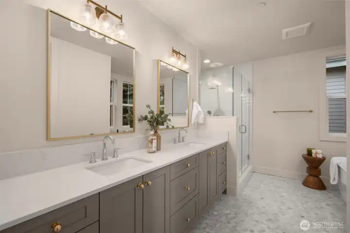 Heated floors + dual sinks.