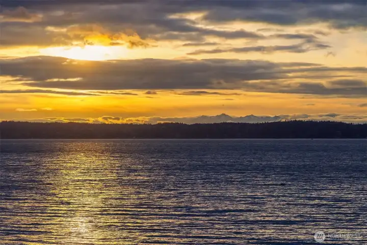 Welcome to glowing sunsets, snow-capped Olympics & shimmering Puget Sound waters with this striking beach property.