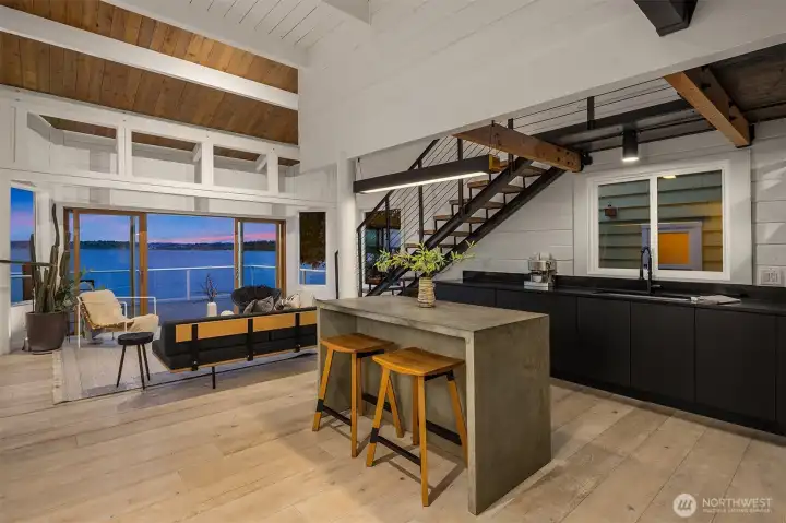 Vaulted ceilings and open flow making doubling the feel of volume and living space.