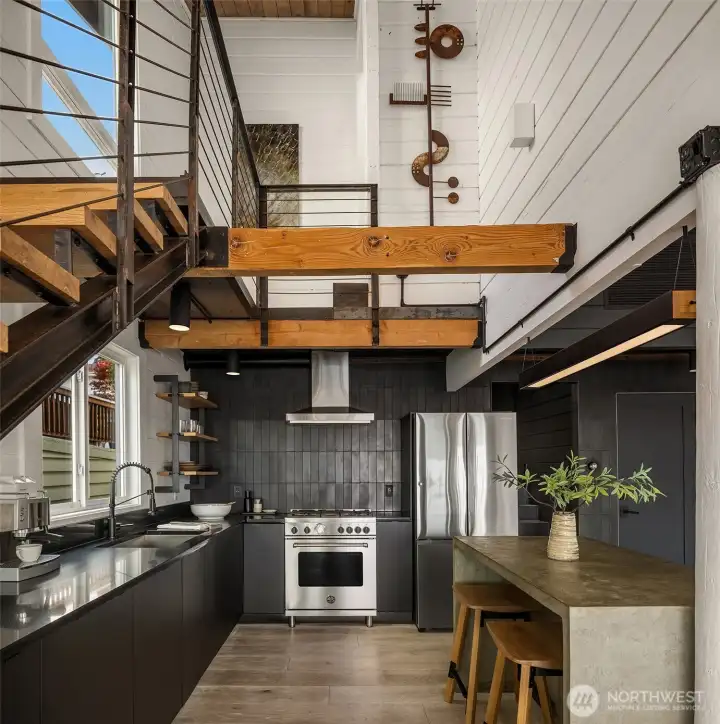 A striking room allying functionality and design. The custom staircase leads to the private primary ensuite.