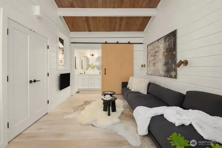 Fresh finishes for the bathroom made private with the barn door.