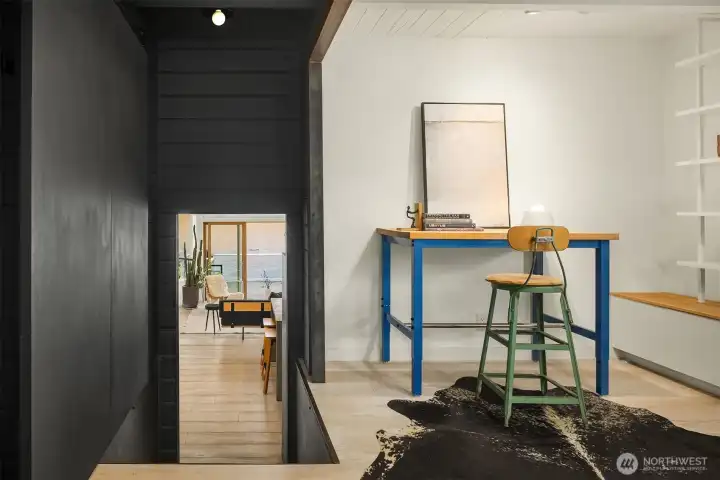 Perspective from the main level into this versatile space: art studio, library or home office.