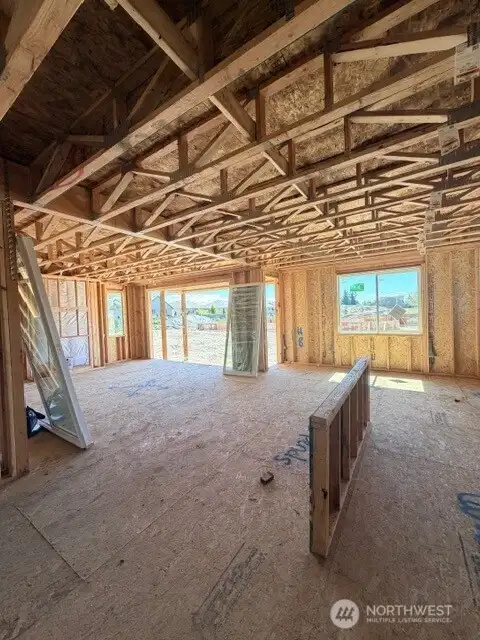 Open living kitchen and dining with 12' slider to covered patio