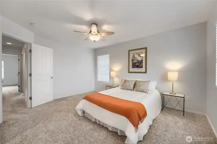 Double doors lead into the large primary bedroom that's big enough for all your furniture.