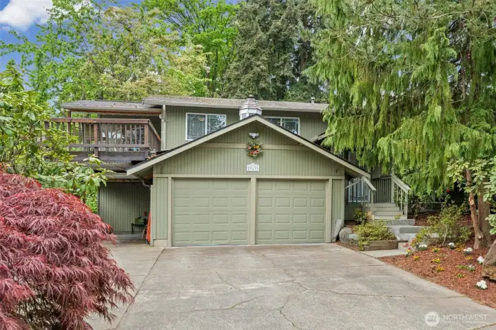 Welcome home to this private, park-like retreat tucked among the trees.
