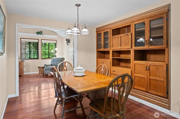 Dining room with built-in hutch and cherry hardwoods, perfectly positioned between gathering spaces.