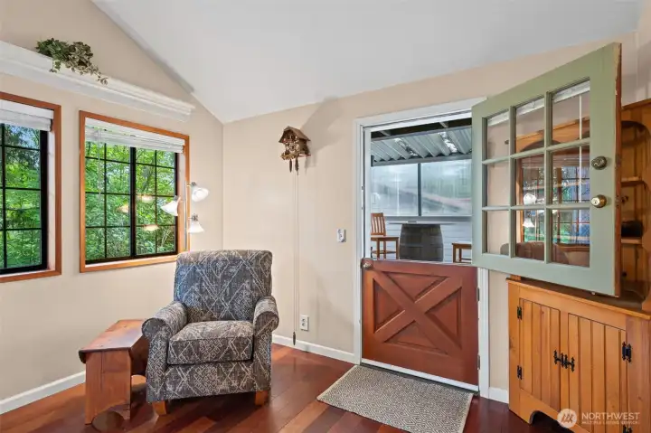 Dutch door opens from the kitchen to one of two covered outdoor living spaces.
