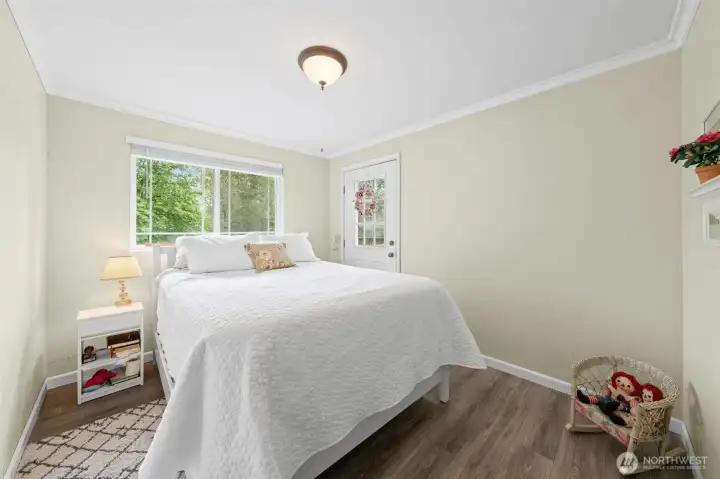 One of three additional bedrooms offering flexibility for guests, hobbies, or workspace.